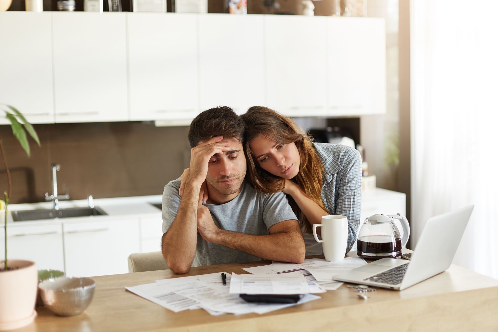 Adult children sorting through a parent's belongings at home